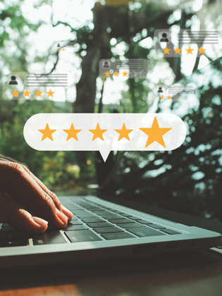 Person on laptop leaving a 5 BUNQ Online Google review