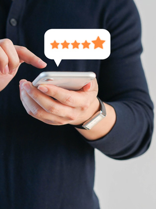 Person holding smart phone and leaving a 5 BUNQ Online Google review